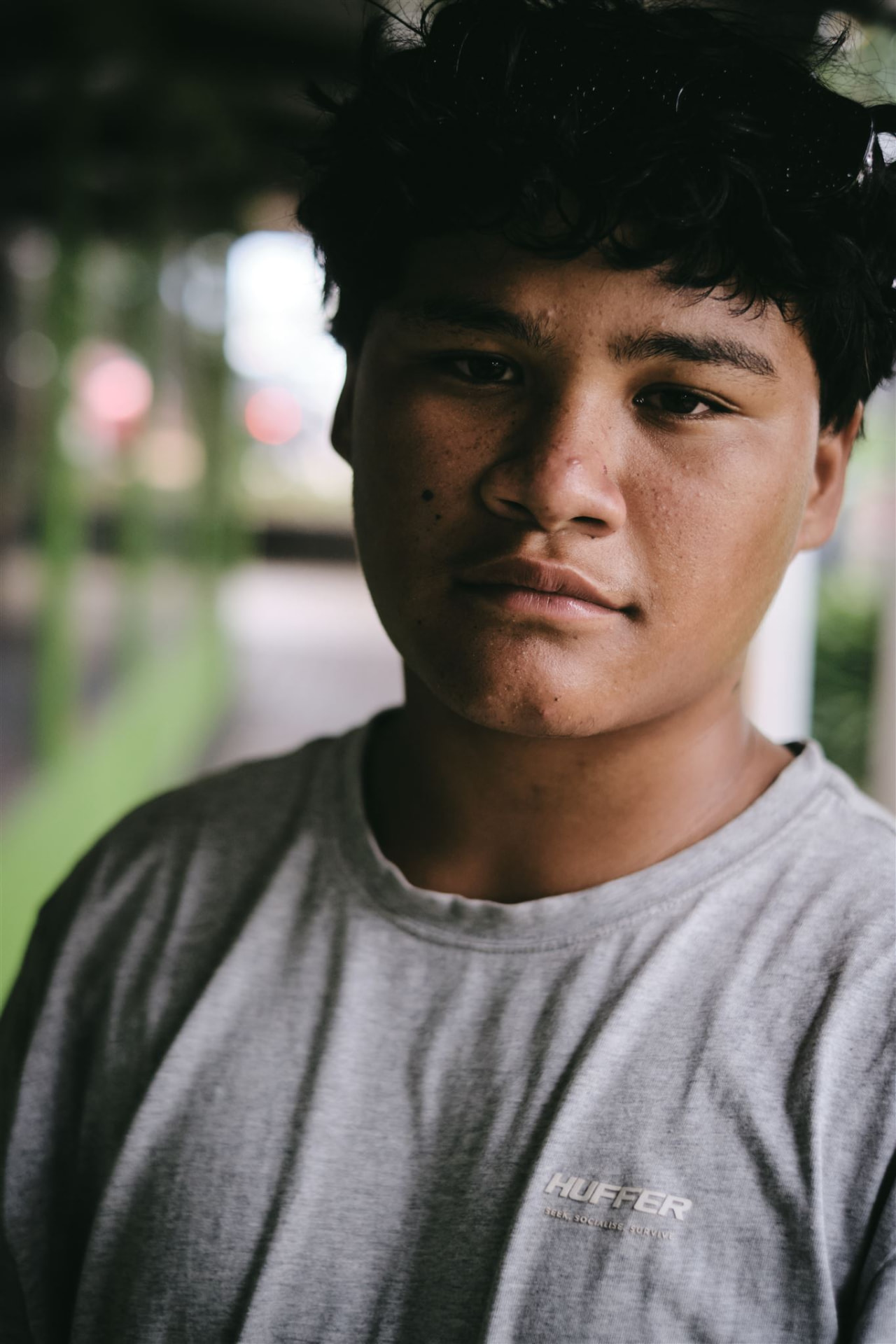 A young person looking directly at the camera